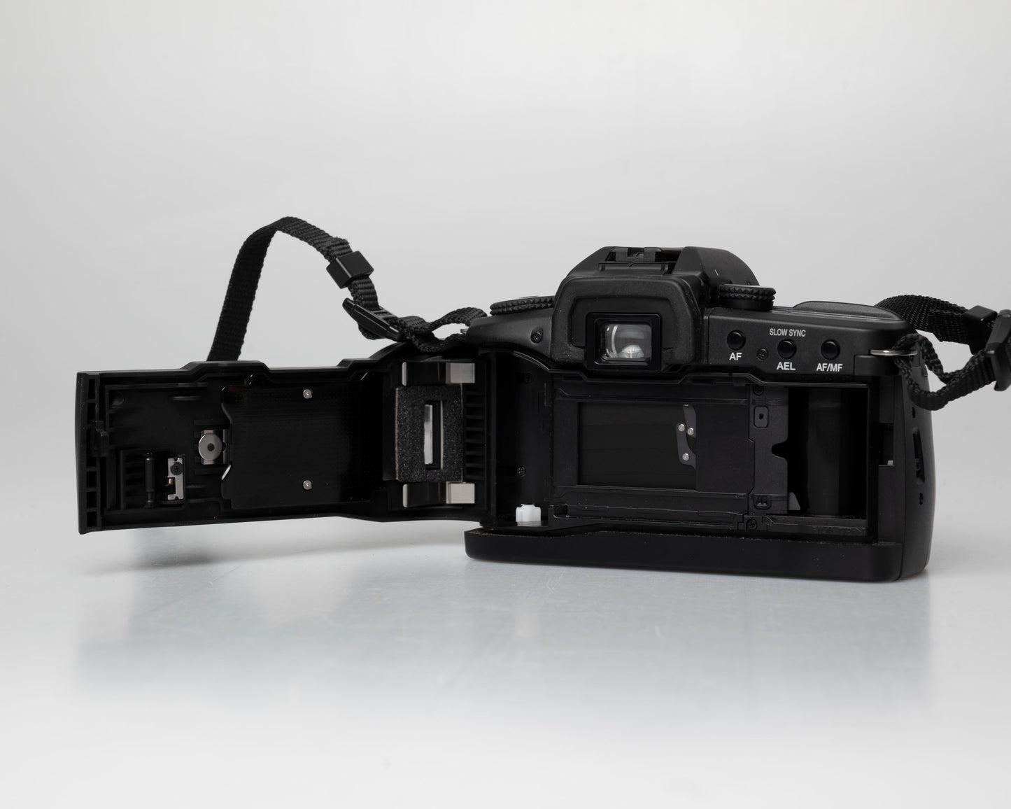 Minolta Maxxum 70 35mm film camera with 50mm f1.7 lens; back view with film door open