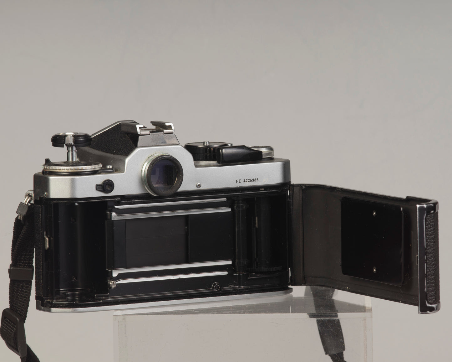 Nikon FE 35mm film SLR camera with Nikon E 50mm f1.8 lens. Available at New Wave Pool, Montreal.