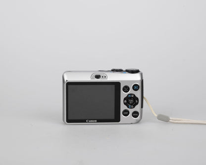 Canon Powershot A1200 digicam w/ 12 MP CCD sensor + 2 GB SD card (uses AA batteries)