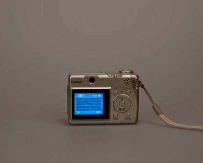 Canon Powershot A530 digicam w/ 5 MP CCD sensor; includes 512MB SD card (uses AA batteries) + original box & manual