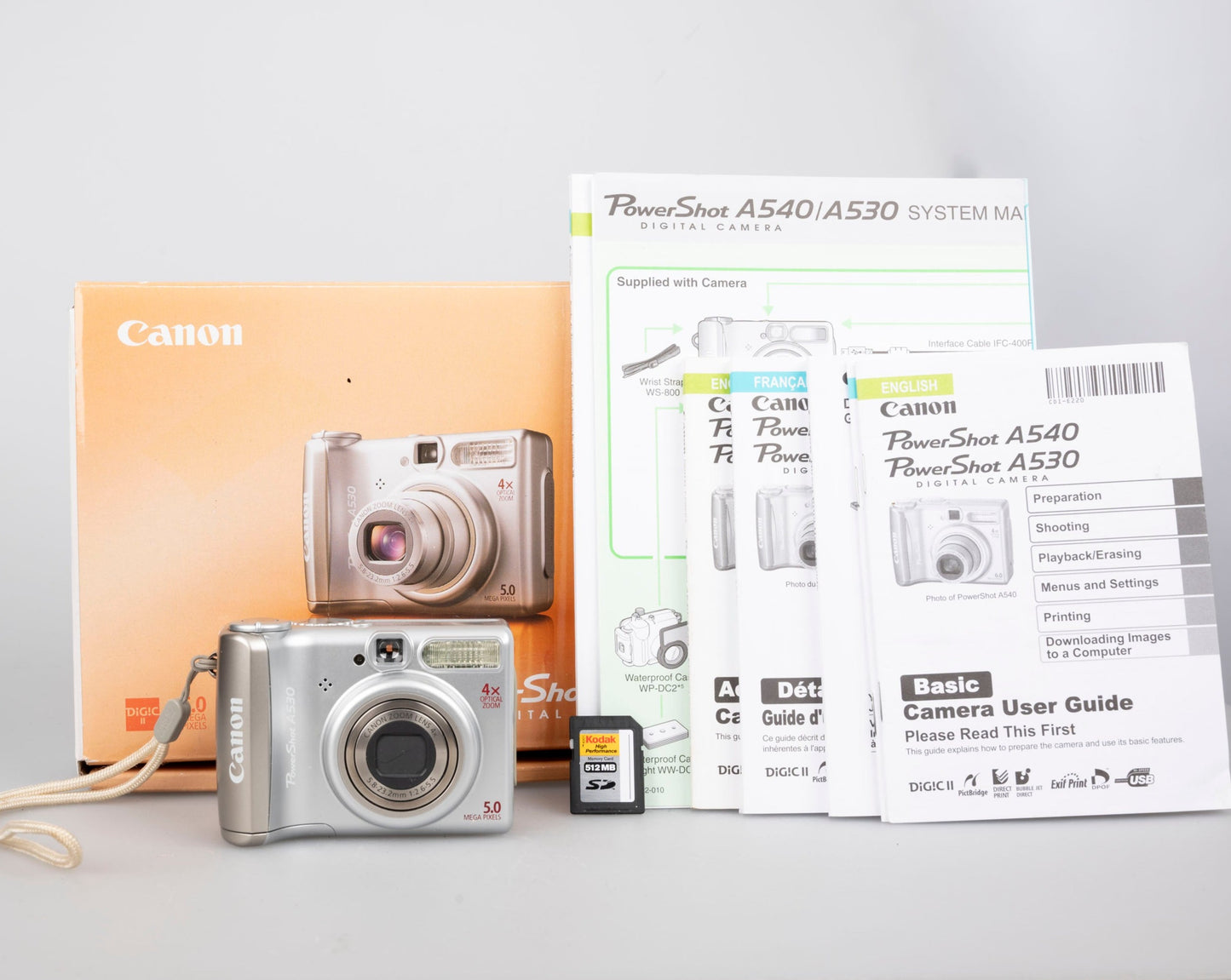 Canon Powershot A530 digicam w/ 5 MP CCD sensor; includes 512MB SD card (uses AA batteries) + original box & manual