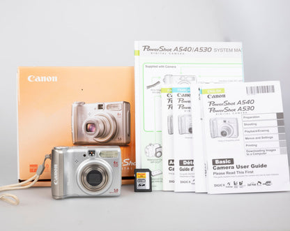 Canon Powershot A530 digicam w/ 5 MP CCD sensor; includes 512MB SD card (uses AA batteries) + original box & manual