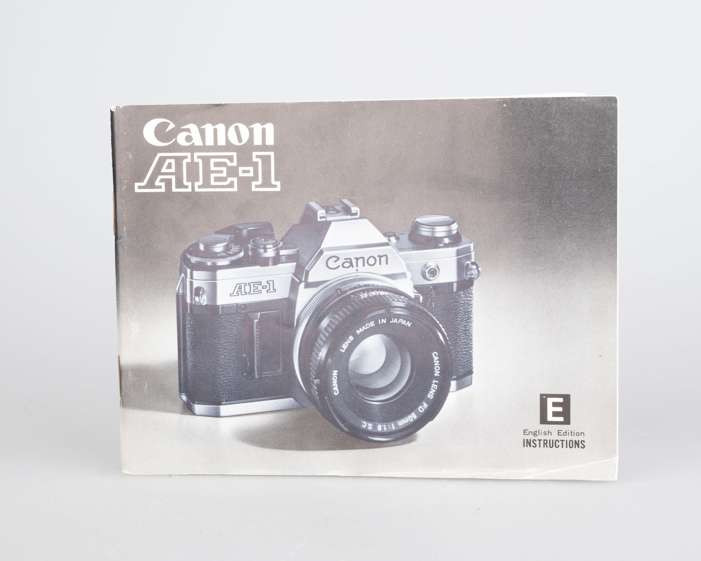 Canon AE-1 35mm SLR w/ Canon FD 50mm f1.8 lens + Speedlite 188A flash + original manual (serial 2388361)