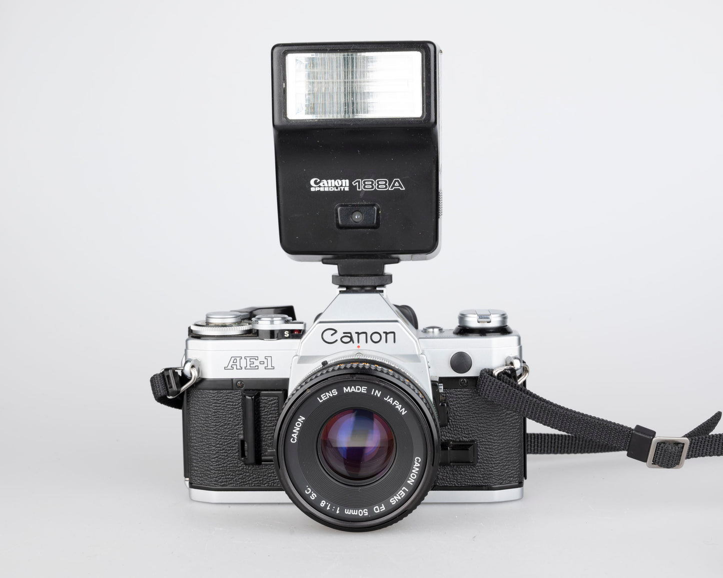 Canon AE-1 35mm SLR w/ Canon FD 50mm f1.8 lens + Speedlite 188A flash + original manual (serial 2388361)