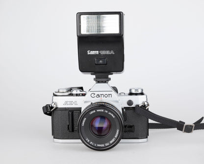 Canon AE-1 35mm SLR w/ Canon FD 50mm f1.8 lens + Speedlite 188A flash + original manual (serial 2388361)