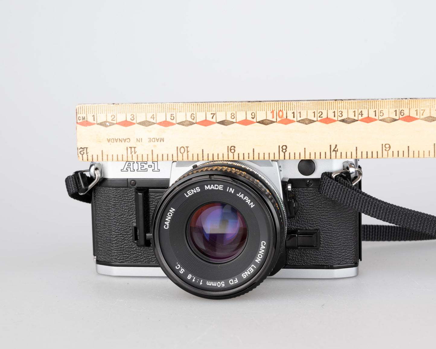 Canon AE-1 35mm SLR w/ Canon FD 50mm f1.8 lens + Speedlite 188A flash + original manual (serial 2388361)