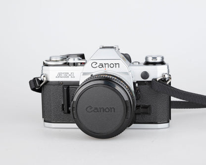 Canon AE-1 35mm SLR w/ Canon FD 50mm f1.8 lens + Speedlite 188A flash + original manual (serial 2388361)