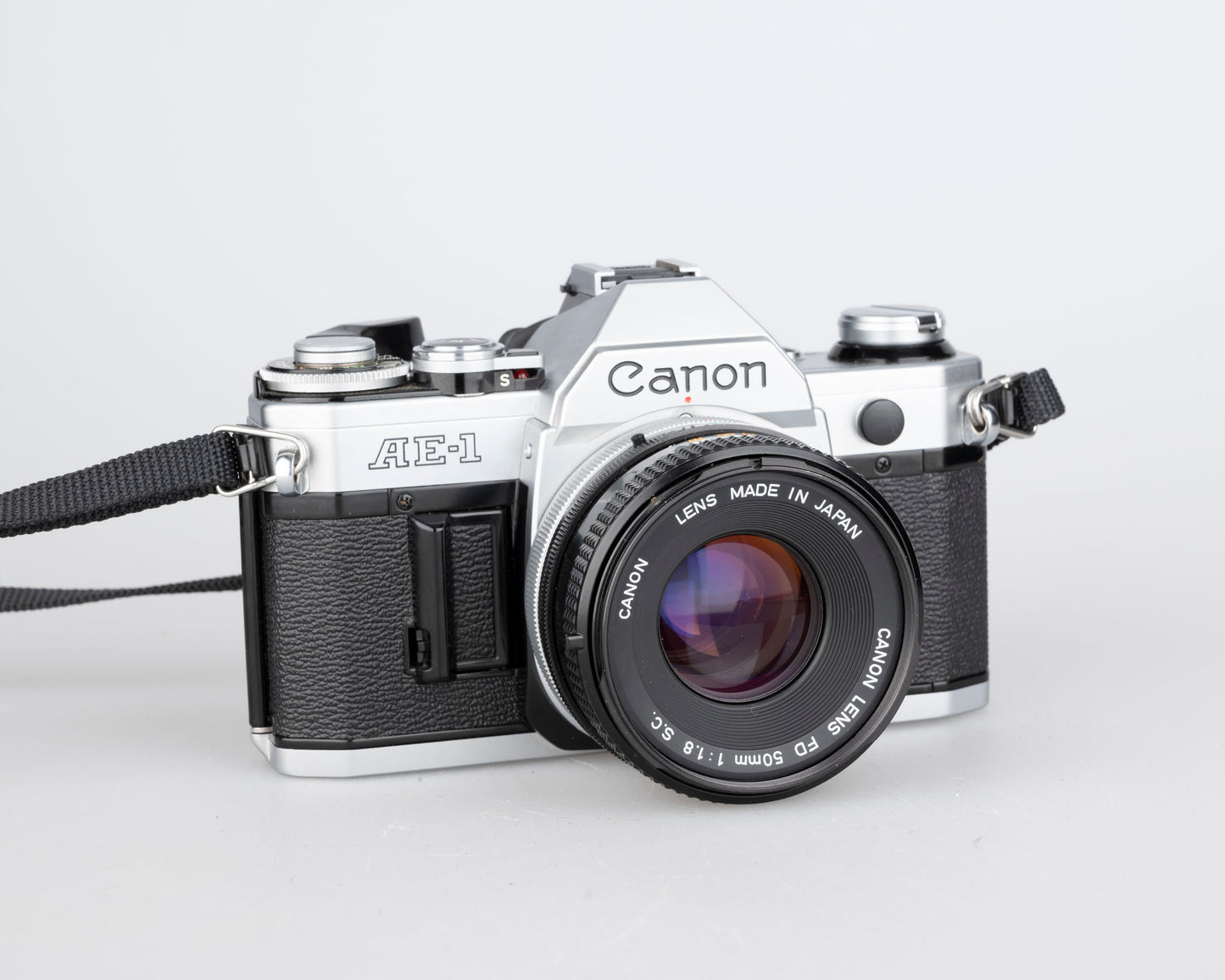 Canon AE-1 35mm SLR w/ Canon FD 50mm f1.8 lens + Speedlite 188A flash + original manual (serial 2388361)