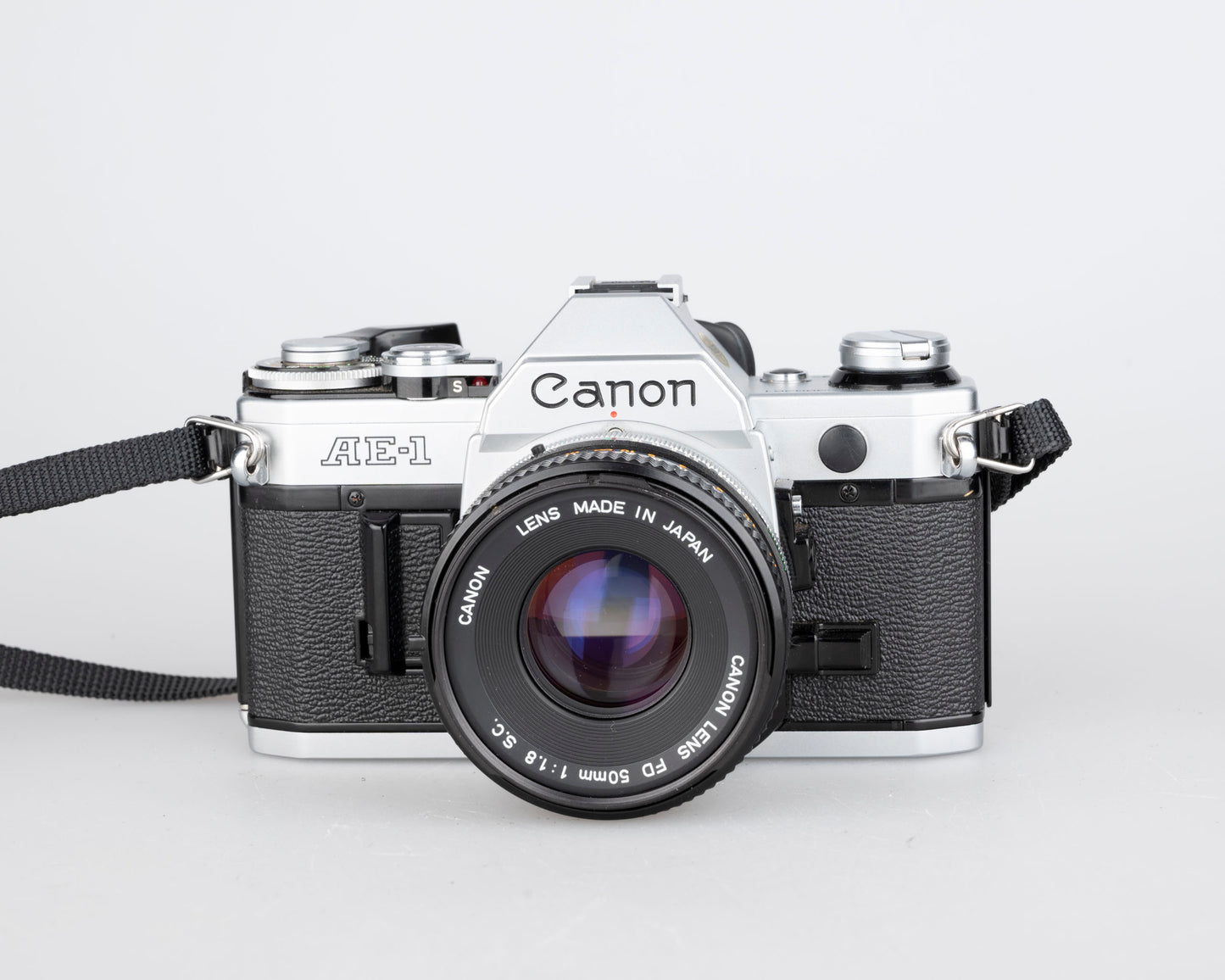 Canon AE-1 35mm SLR w/ Canon FD 50mm f1.8 lens + Speedlite 188A flash + original manual (serial 2388361)