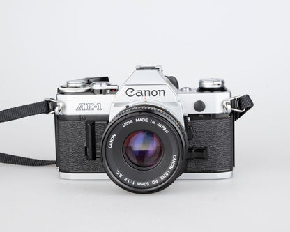 Canon AE-1 35mm SLR w/ Canon FD 50mm f1.8 lens + Speedlite 188A flash + original manual (serial 2388361)