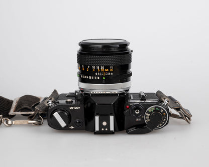 Canon AE-1 35mm SLR w/ Canon FD 50mm f1.4 S.S.C. lens + original manual (serial 291207)