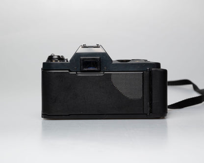 Canon T50 35mm film SLR camera w/FD 50mm f1.8 lens (serial 1316532)