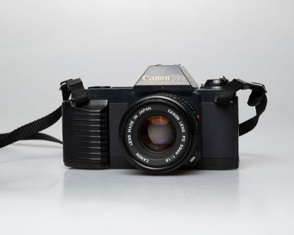 Canon T50 35mm film SLR camera w/FD 50mm f1.8 lens (serial 1316532)