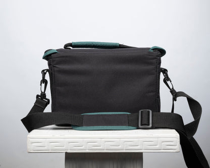 Canon black and green mid-sized camera shoulder bag