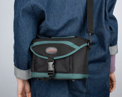 Canon black and green mid-sized camera shoulder bag