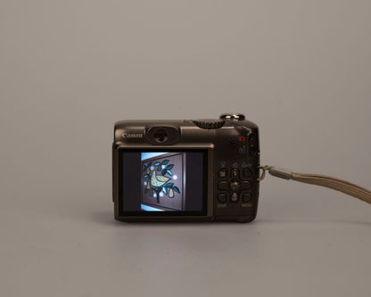 Canon Powershot A590 IS digicam w/ 8 MP CCD sensor; includes 512MB SD card (uses AA batteries)
