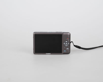 Canon Powershot Digital Elph 100 HS 12.1MP digicam w/ 8GB SD card + battery + charger