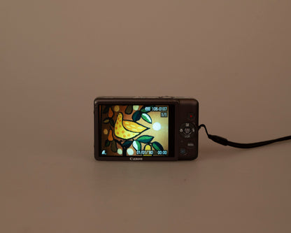 Canon Powershot Digital Elph 100 HS 12.1MP digicam w/ 8GB SD card + battery + charger