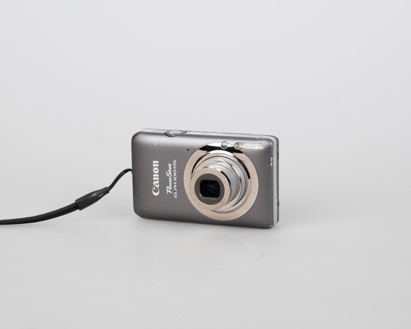 Canon Powershot Digital Elph 100 HS 12.1MP digicam w/ 8GB SD card + battery + charger