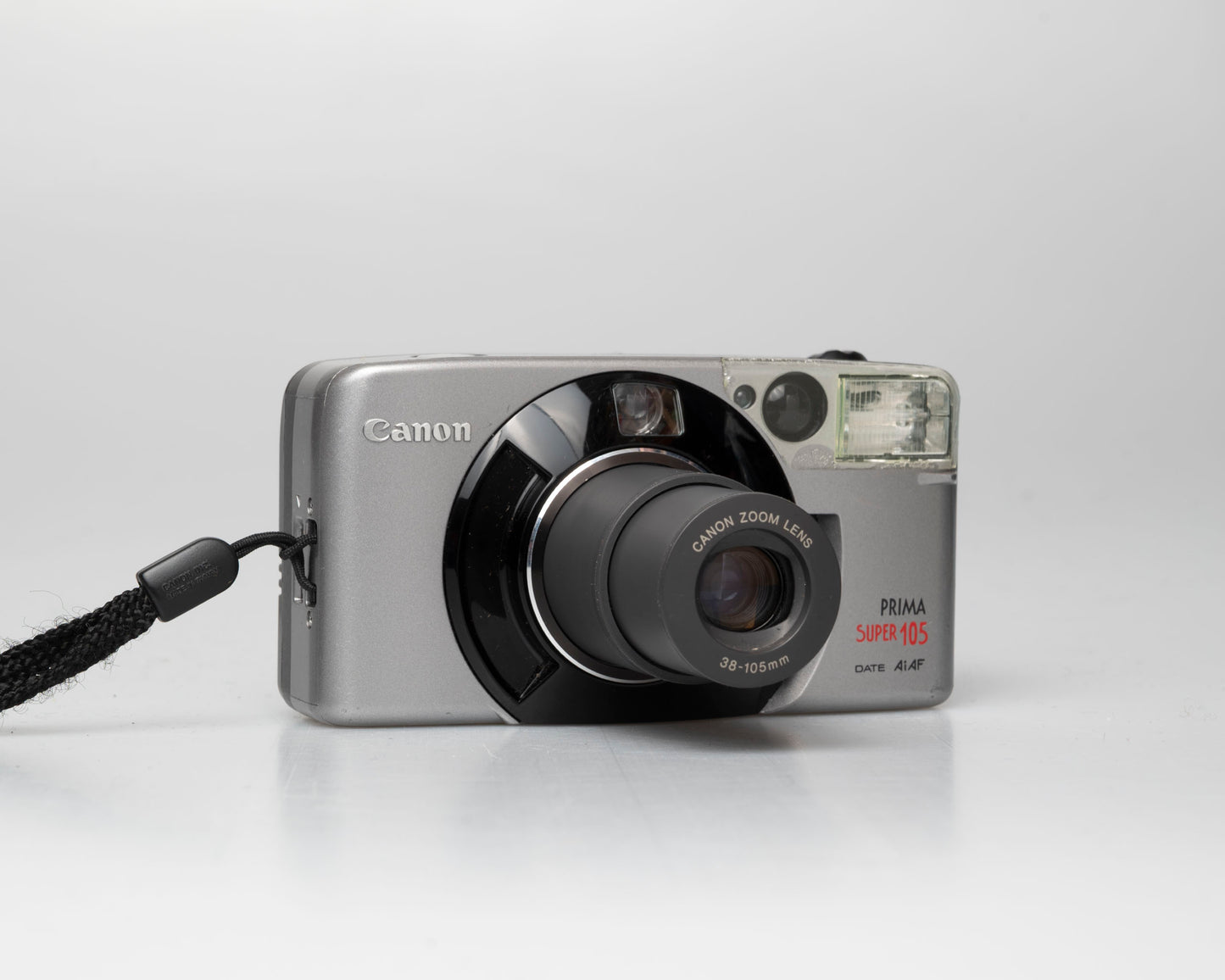 Appareil photo argentique Canon Prima Super 105 Date 35mm avec étui (numéro de série 4421072)