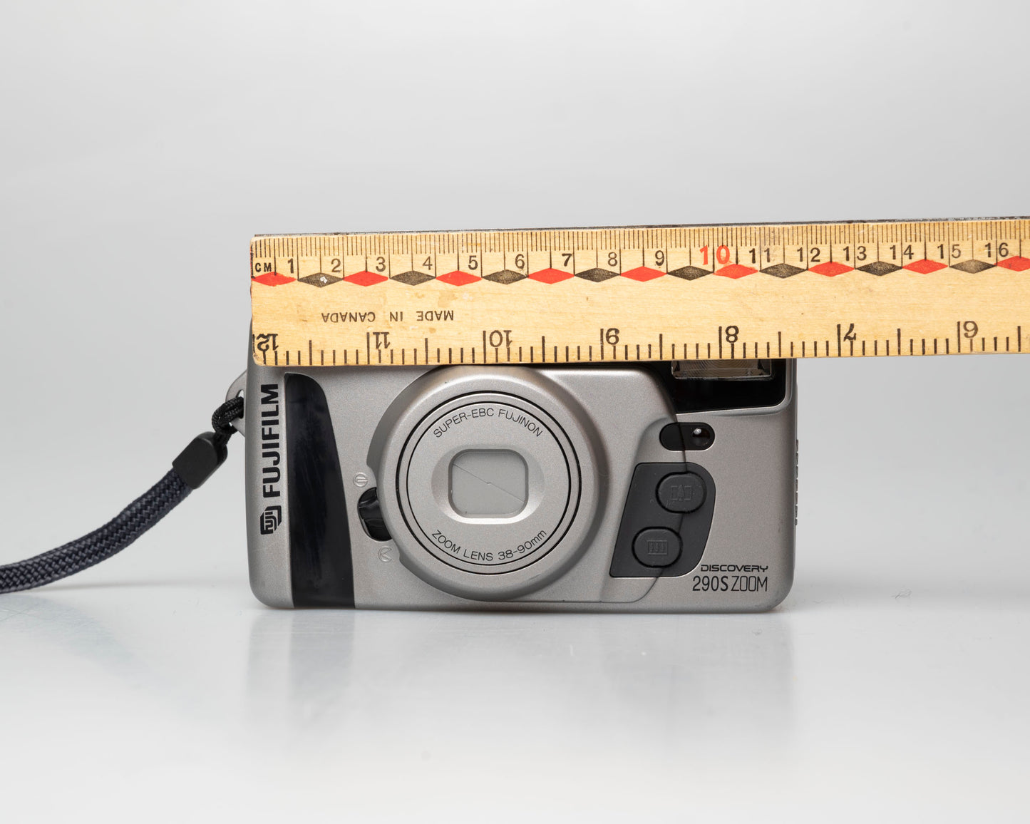 Fuji Discovery S290S Zoom 35mm point-and-shoot camera; front; off; ruler for scale