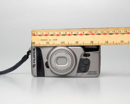 Fuji Discovery S290S Zoom 35mm point-and-shoot camera; front; off; ruler for scale