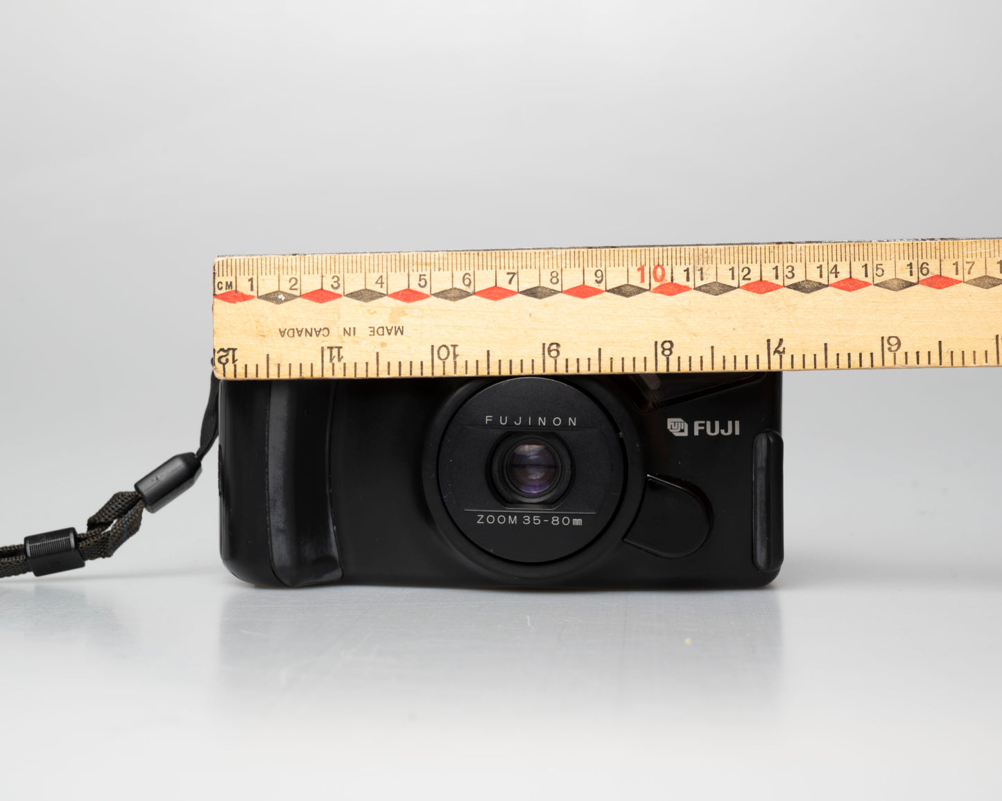 Fuji DL-1000 (aka Discovery 1000 Zoom) 35mm point-and-shoot; front; on; ruler for scale
