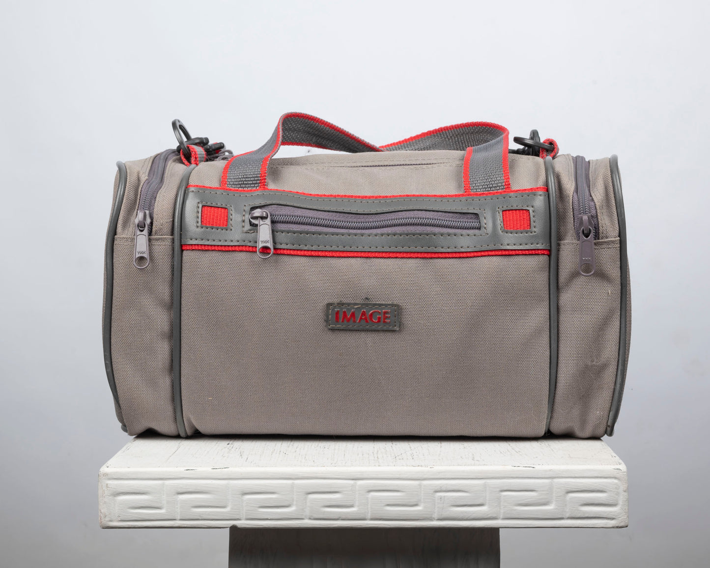 Image mid-sized grey and red camera bag