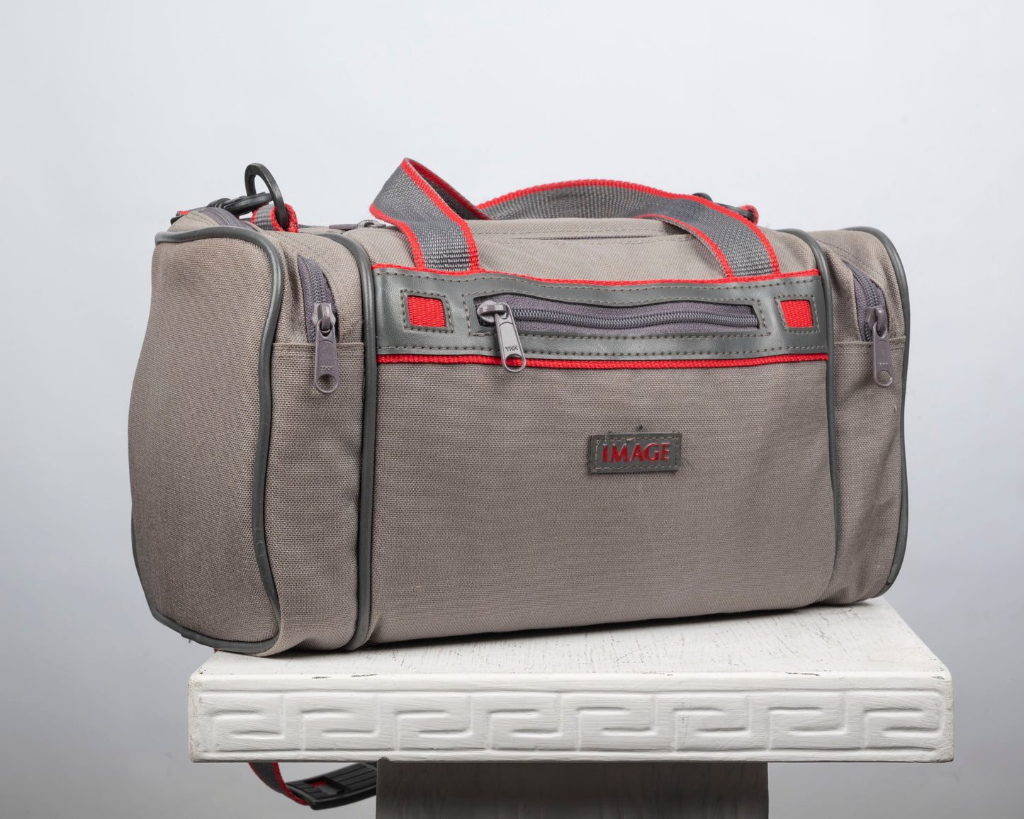 Image mid-sized grey and red camera bag