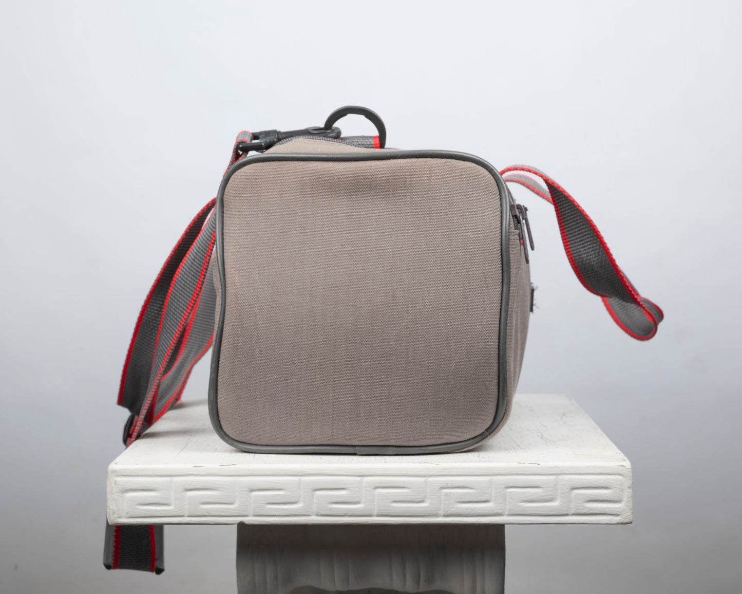 Image mid-sized grey and red camera bag