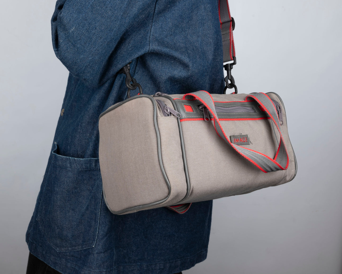 Image mid-sized grey and red camera bag