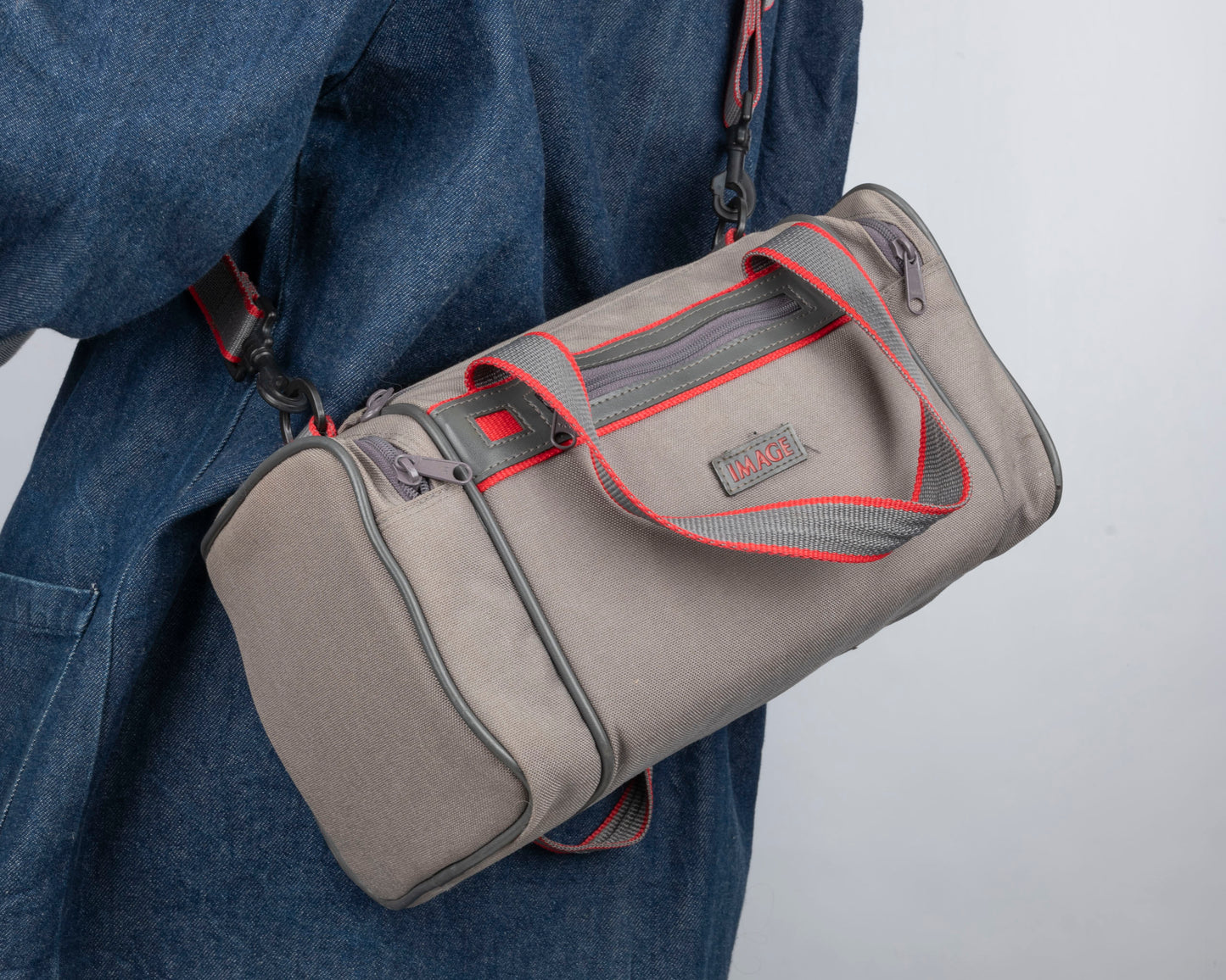 Image mid-sized grey and red camera bag