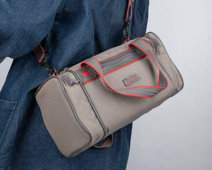 Image mid-sized grey and red camera bag