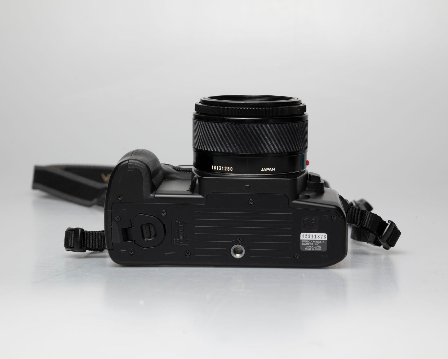 Minolta Maxxum 70 35mm film camera with 50mm f1.7 lens; bottom view