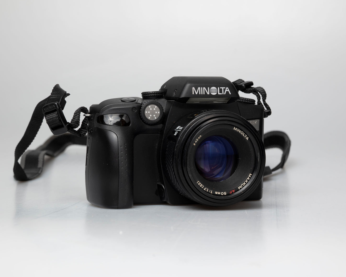 Minolta Maxxum 70 35mm film camera with 50mm f1.7 lens; front view angled