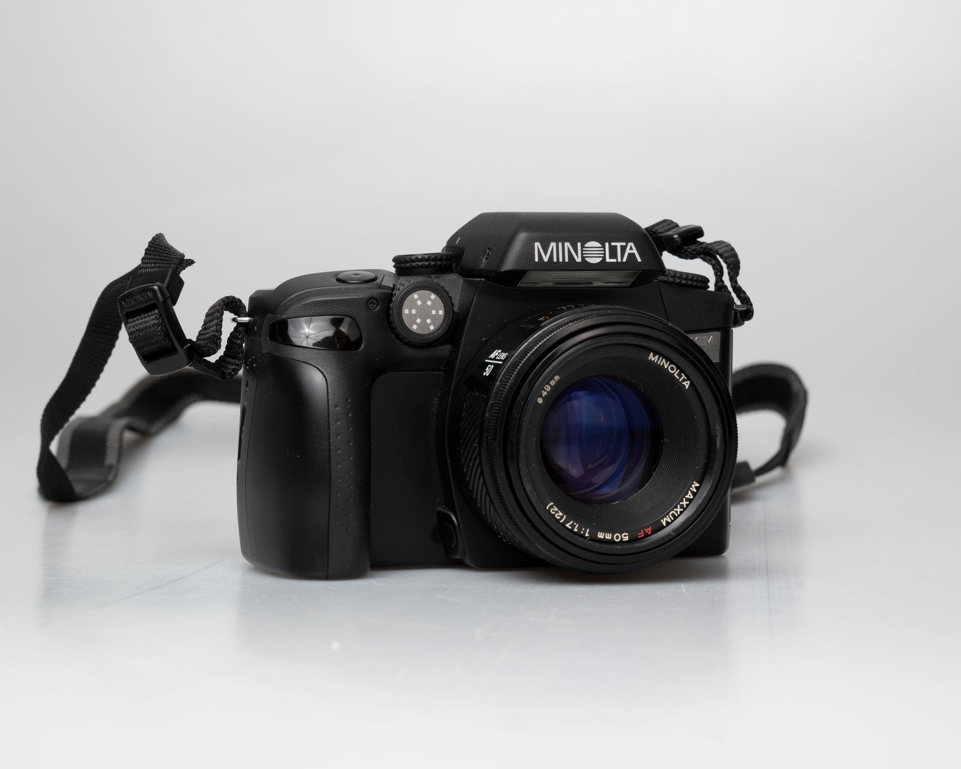Minolta Maxxum 70 35mm film camera with 50mm f1.7 lens; front view angled
