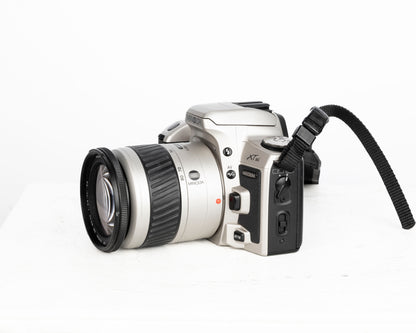 Minolta Maxxum XTsi reflex à film 35 mm avec objectif 28-80 mm + sac pour appareil photo Minolta + télécommande (série 94009570)