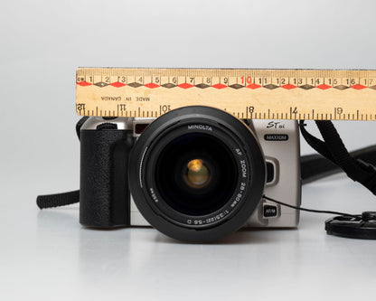 Minolta STsi 35mm SLR film camera; front view with ruler for scale