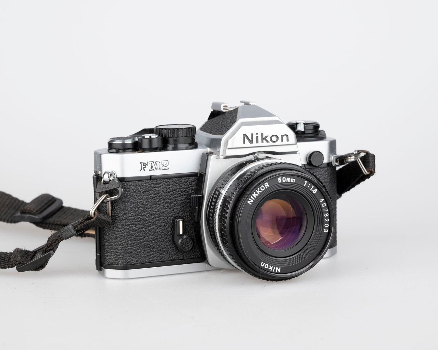 Nikon FM2n 35mm film SLR camera w/ Nikkor 50mm f1.8 lens + manuals in English and French (serial 8518258)