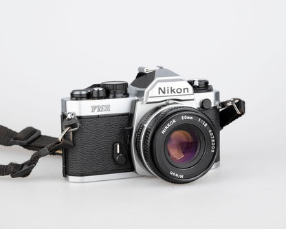 Nikon FM2n 35mm film SLR camera w/ Nikkor 50mm f1.8 lens + manuals in English and French (serial 8518258)
