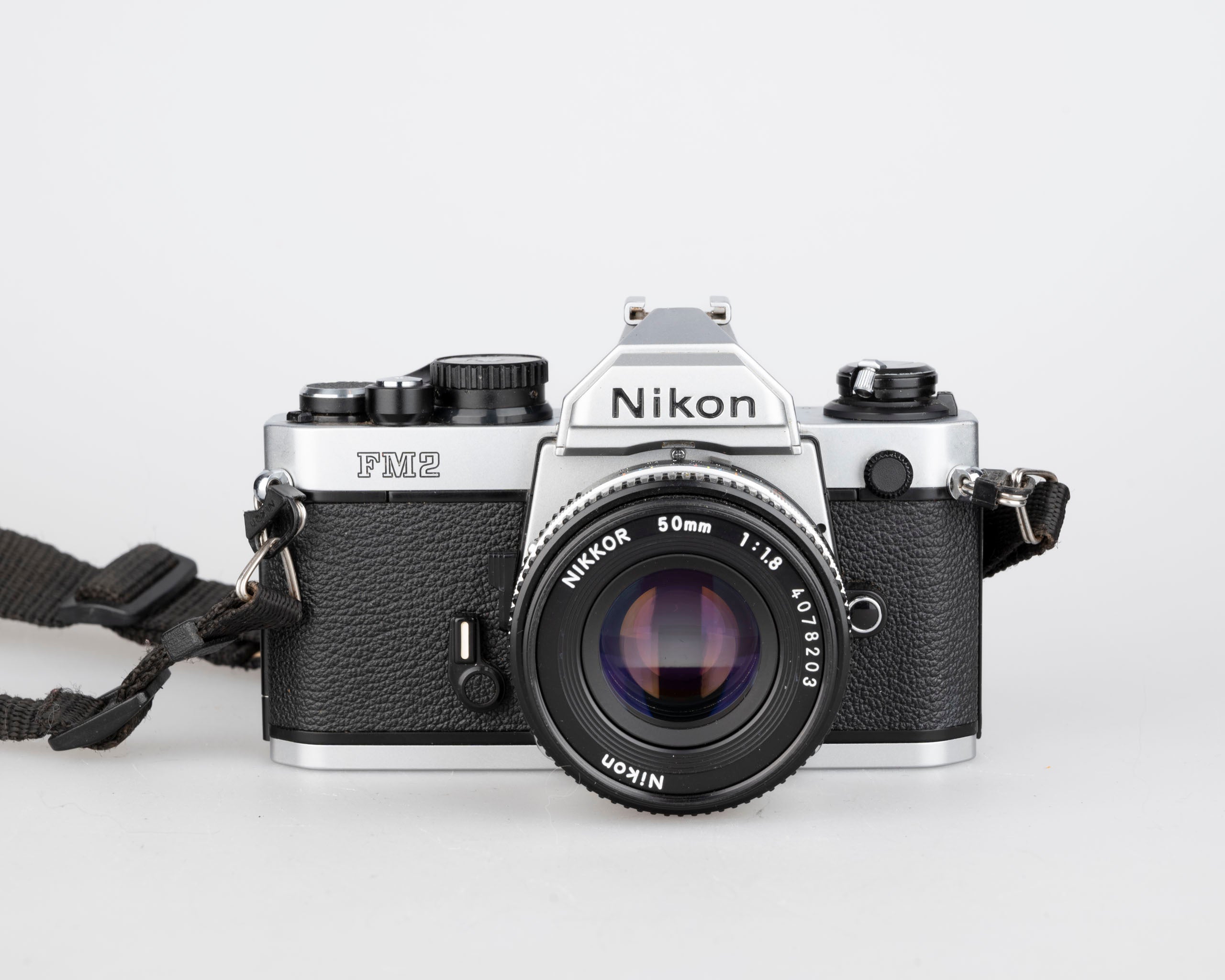 Nikon FM2n 35mm film SLR camera w/ Nikkor 50mm f1.8 lens + manuals