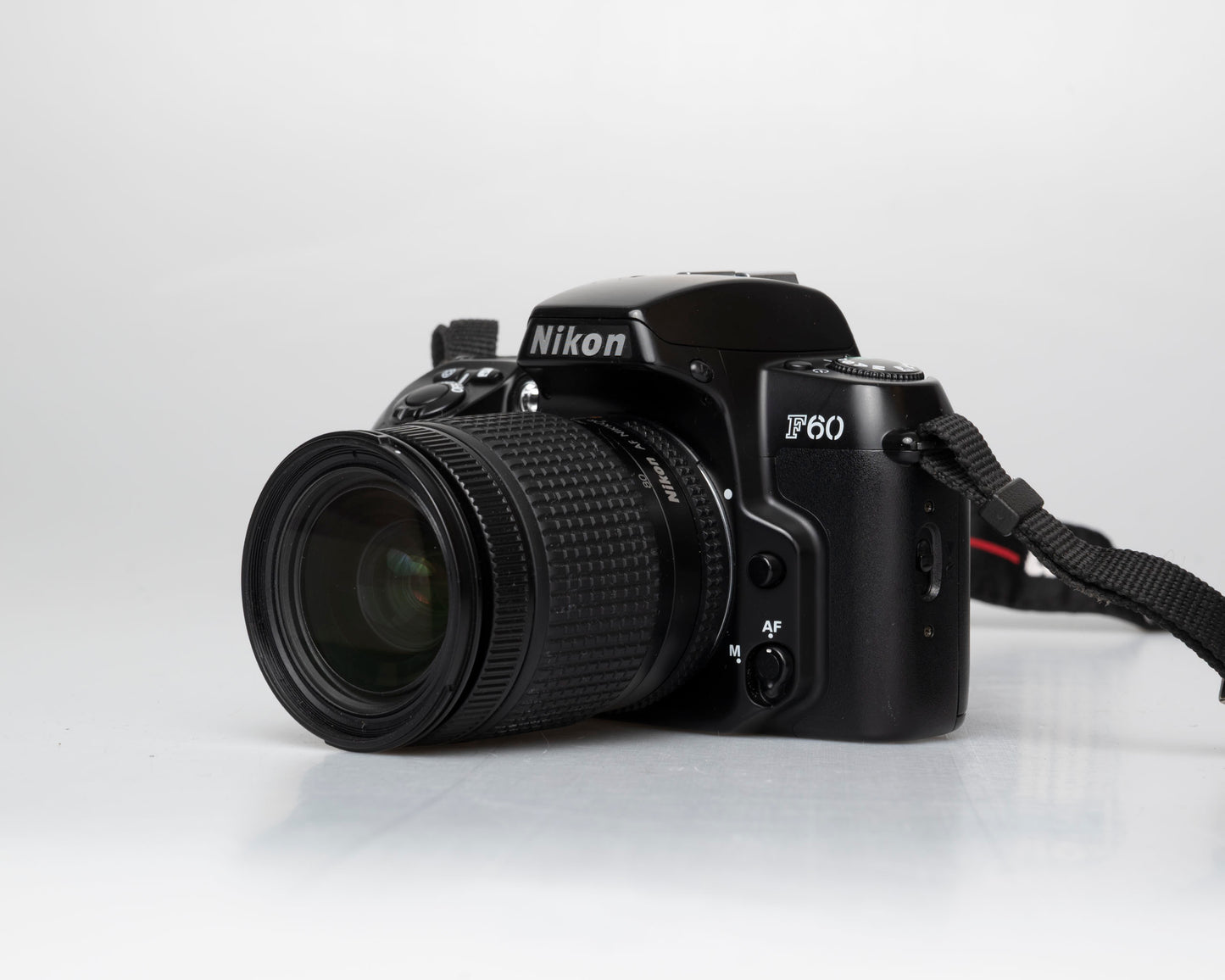 Nikon F60 35mm film SLR w/ AF Nikkor 28-80mm lens + manual (serial 2696418)