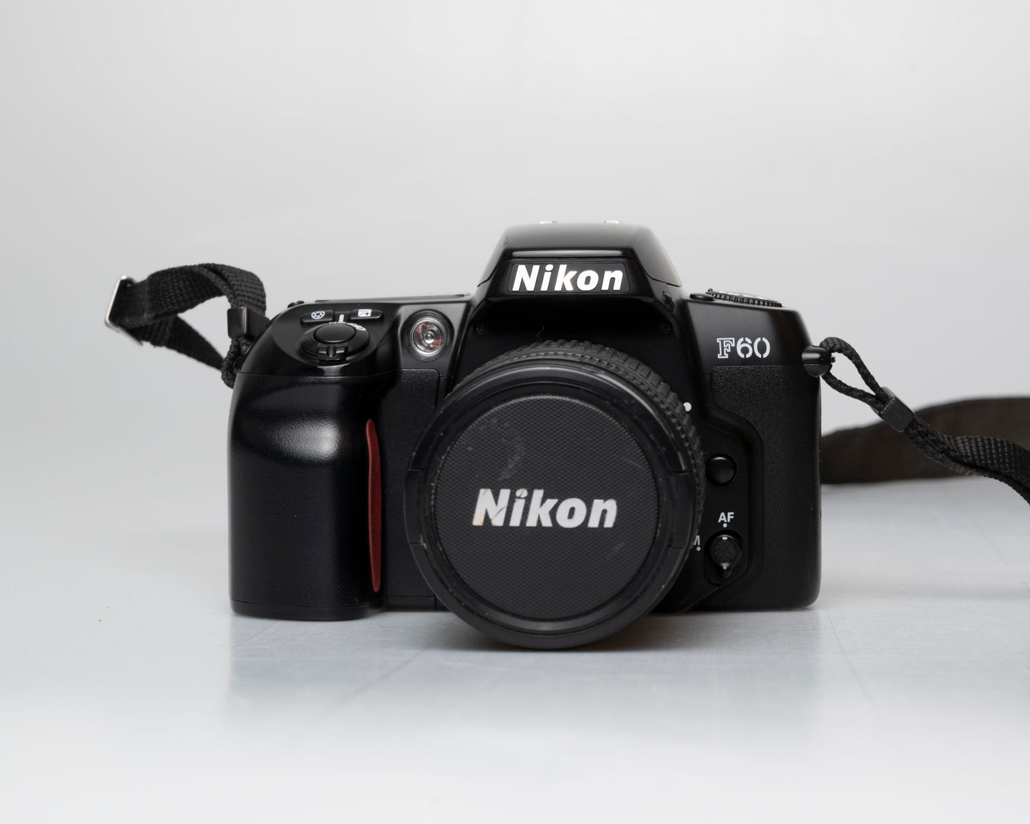 Nikon F60 35mm film SLR w/ AF Nikkor 28-80mm lens + manual (serial 2696418)