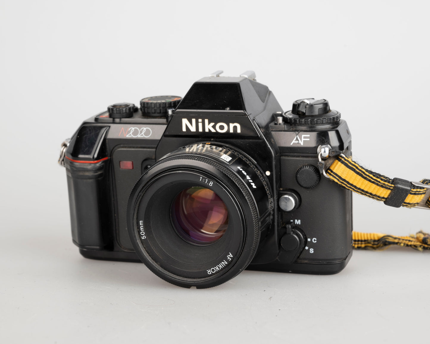 Nikon N2020 35mm film SLR w/ AF Nikkor 50mm f1.8 lens (serial 5387168)