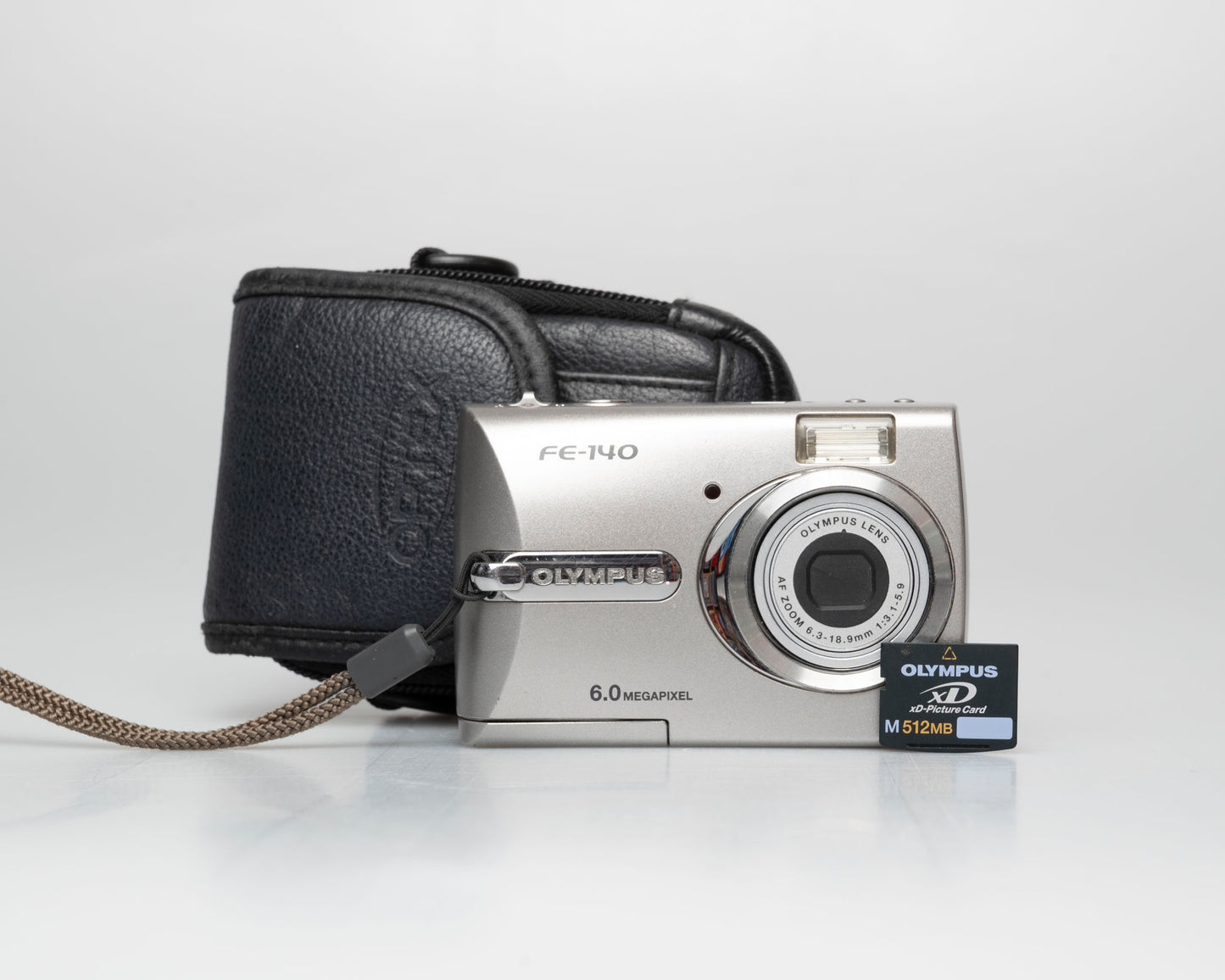 Olympus FE-140 6MP CCD sensor digicam w/ 512MB xD card (serial J69229231)