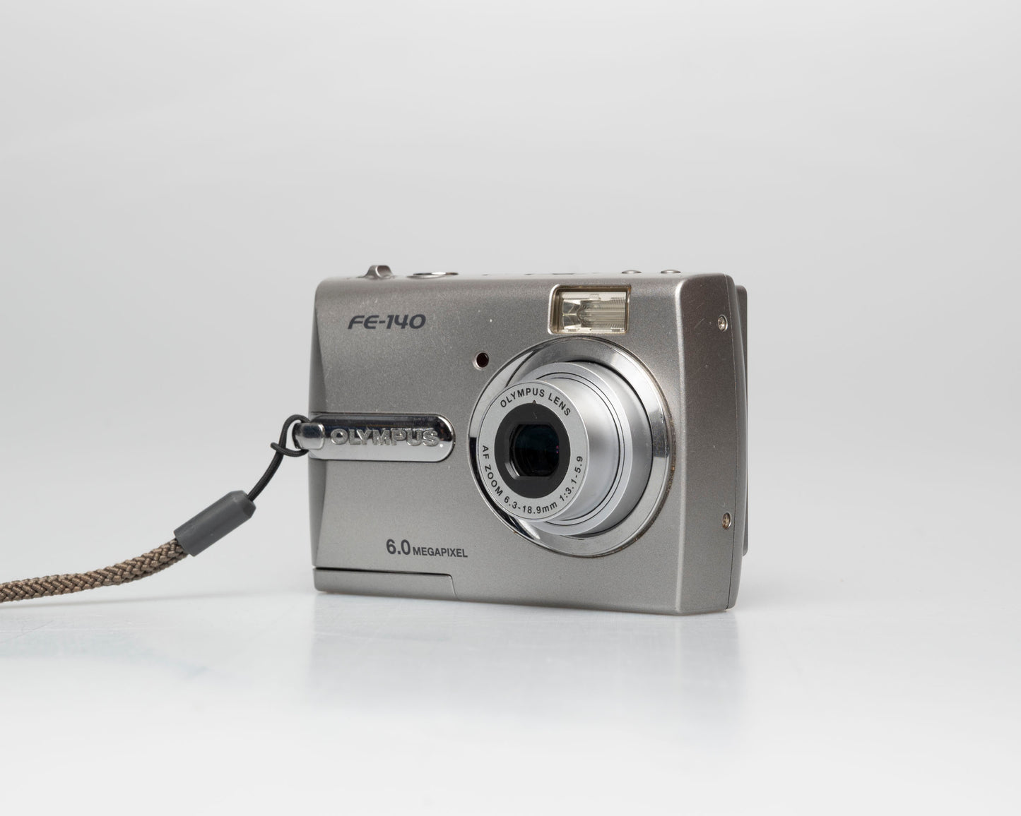 Olympus FE-140 6MP CCD sensor digicam w/ 512MB xD card (serial J69229231)