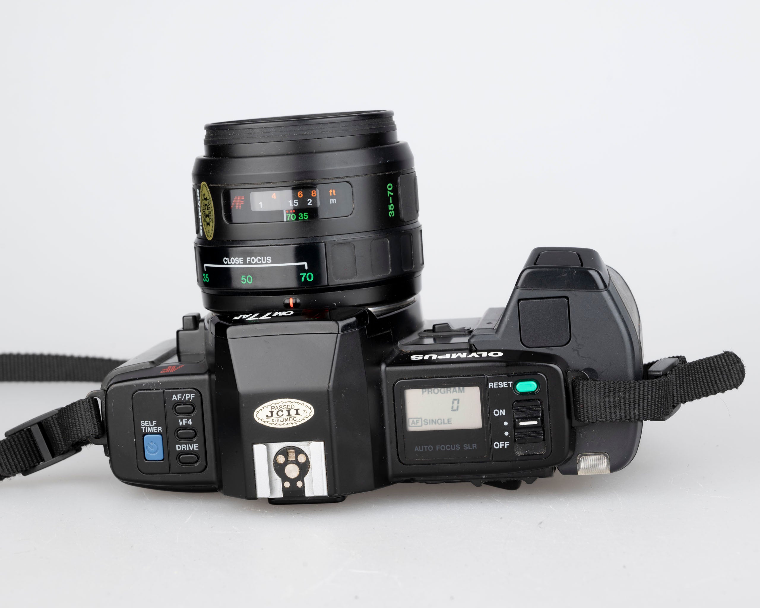 Olympus OM-77AF 35mm film SLR w/ 35-70mm compact zoom len (serial