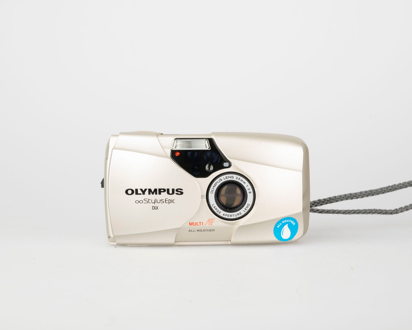 Olympus ∞ Stylus Epic (alias mju II ou µ[Mju:]-II) Appareil photo argentique 35 mm avec étui + télécommande + manuel (série 7830782)