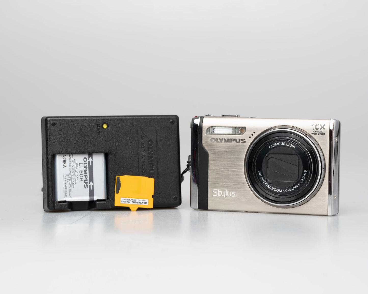 Olympus Stylus 9000 12MP digicam w/ 16GB card + adapter + charger + battery (serial H16512514)