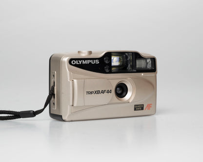Olympus Trip XB AF44 compact 35mm film point-and-shoot camera; left angle view lens cover open